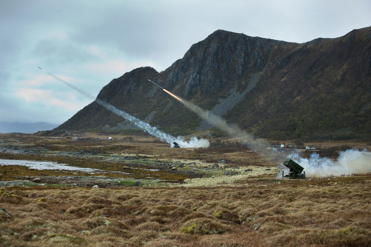 Photo of surface-to-air missiles being launched. Norwegian landscape.
